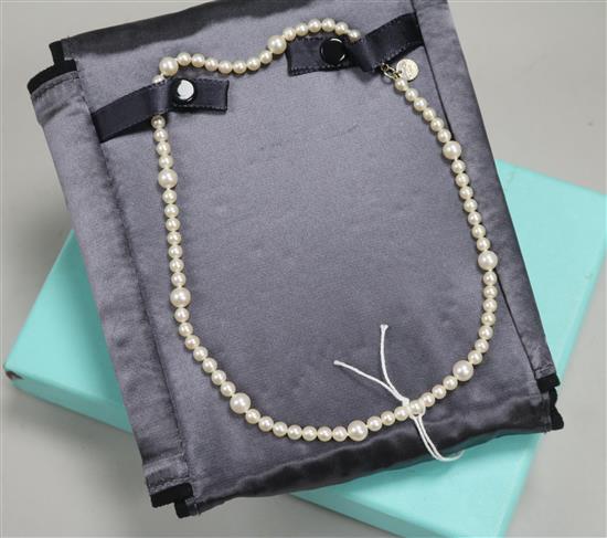 A Tiffany & Co single strand cultured pearl necklace with sterling silver clasp and Tiffany box and pouch, approx. 40cm.